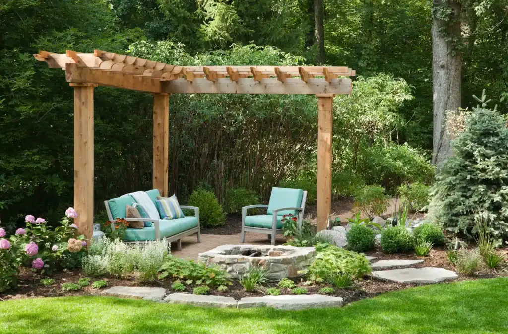 Natural wooden pergola with outdoor seating and lush garden landscaping, ideal for relaxing and outdoor entertaining.