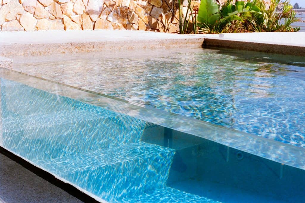 A sleek fiberglass pool with a modern design, perfect for Louisiana yards, showcasing durability and low maintenance.